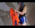 Mara wearing a sexy shiny swimsuit and a shiny nylon shorts trying on a lifevest (Video)