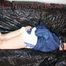 LUCY tied and gagged with ropes and a cloth gag wearing a supersexy white shiny nylon shorts and blue rain jacket (Pics)