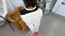 Rey Sanson bound and gagged in a shiny nylon Downjacket during a Fotoshooting