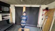 Lana tied and gagged and gagged to Post in shiny nylon Rainwear