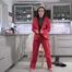 Miss Amira in red nylon rain gear and tranparent rain suit