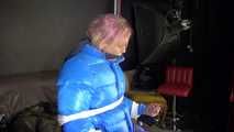 Sexy Pia being tied and gagged with ropes and a cloth gag on a hairdressers chair wearing a sexy blue shiny nylon rainpants and a lightblue downjacket (Video)