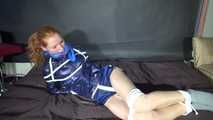 ***RONJA*** being tied and gagged on a sofa with ropes and a clothgag wearing a sexy blue shiny nylon shorts and a rainjacket (Video)