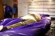 Pia wearing a very hot golden shiny nylon rain pants and a white extraordinary rain jacket blazer posing for you in bed (Pics)