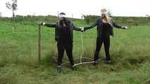 Jasmin & Larissa tied on fence Photoshoot