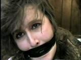 ERICA IS MOUTH STUFFED, WRAP TAPE GAGGED & BALL-TIED (D29-8)