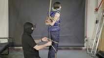 Lana bound and gagged in a shiny nylon Downvest