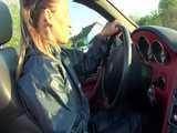Get a Video with Sandra walking in her shiny nylon Rainsuit at a very hot and sunny day