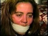 24 YR OLD LATINA HOUSEWIFE MOUTH STUFFED, WRAP TAPE GAGGED, BAREFOOT & TOE TIED (D61-11)