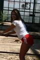 Stella posing outdoor wearing a supersexy red shiny nylon shorts and a white top (Pics)