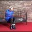 Pia tied, gagged and hooded on a princess bed in an old cellar wearing a sexy shiny down coat, down pants and down boots (Video)
