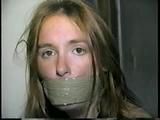 24 Yr OLD CRAFTER IS WRAP TAPE GAGGED, BAREFOOT TICKLED, TOE-TIED, BALL-TIED, HANDGAGGED & MOUTH STUFFED (D61-1)