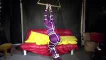 Watching sexy Sonja wearing a supersexy purple shiny nylon rainwear combination being tied and gagged overhead with ropes and a clothgag (Video)