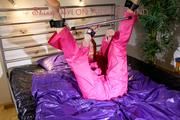 Pia ties and gagges herself on a bar in bed wearing a supersexy pink rainsuit (Pics)