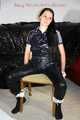 Lucy tied and gagged with rope and gag on a chair wearing a sexy black shiny nylon jumpsuit (Pics) 