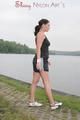 Enni outdoor wearing a sexy black shiny nylon shorts and a black top (Pics)