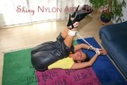 Stella tied and gagged on the floor wearing a shiny nylon rain pants (Pics)