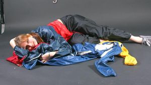 Anastasia posing in a foto studio wearing supersexy oldschool red/blue rainwear (Pics)