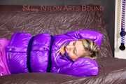 *** HOT HOT HOT*** NEW MODELL*** SANDRA wearing a sexy transparent purple shiny nylon pants and a purple down jacket tied and gagged on a sofa with ropes hand to feet and a cloth gag (Pics)