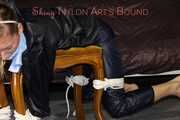 Watching sexy Sandra wearing a sexy blue shiny nylon pants and a rain jacket being tied and gagged with ropes and a clothgag on a stool (Pics)