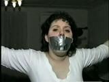 19 Yr OLD JENNIFER IS MOUTH STUFFED, TAPE GAGGED, TIED WITH ARMS OUT AND TO 2 PILLARS & CLEAVE GAGGED (D48-10)d, bondage