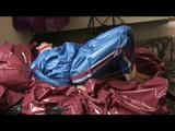 Simone in an blue pvc sauna suit tied and gagged in bed by Sophie (Video)