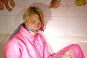 Sonja ties and gagges herself in the bath tub with cuffs wearing sexy shiny nylon downwear (Pics)