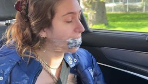 Rey Sanson bound and gagged in a shiny Downcoat