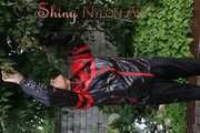Watching sexy Sandra wearing a oldschool black/red shiny nylon rainwear combination while gardening outside (Pics)