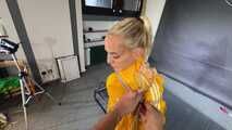 Ms Ungeniert tied and gagged in shiny nylon Rainwear trying to escape