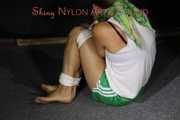 Watching sexy Sandra wearing a sexy green shorts and a white top being tied and gagged on the floor with ropes and a cloth gag (Pics)