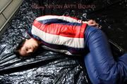 Simone in an old school shiny nylon downwear tied and gagged in bed