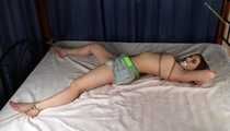 Bianca tied on bed