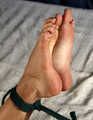 Tapegagged barefoot Kim in red panties and purple bra, hogtied with her elbows tightly tied together, wiggles and rolls on the bed