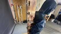 Lana tied and gagged and gagged to Post in shiny nylon Rainwear