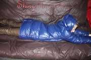 Sexy Sonja changing clothes to a brown down pants and a blue down jacket and lolling on the sofa (Pics)