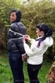 Jill ties her friend in shiny downjackets