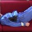 Mara tied and gagged on a sofa wearing sexy shiny rainwear in blue (Video)