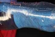 Watching sexy Pia being envelopped in film wearing a sexy blue shiny nylon shorts and a lightblue shiny nylon rainjacket (Pics)