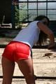 Stella posing outdoor wearing a supersexy red shiny nylon shorts and a white top (Pics)