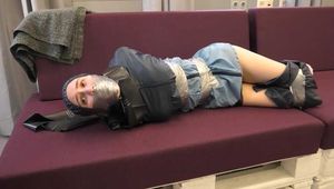 Rey Sanson bound and gagged in a shiny nylon Rainwear gets Pants ripped of