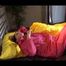 Lucy wearing a supersexy pink rainwear combination lolling in bed (Video)