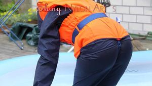 Watching sexy Sonja wearing a sexy shiny nylon rain pant and rain jacket as well as a lifevest enjoying the water in the swimming pool (Pics)