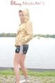 Enni having a good time outdoor wearing sexy shiny nylon shorts and a top posing for the camera (Pics)