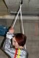 Nicole in an silver shiny PVC sauna suit tied and gagged in an cellar (Pics)