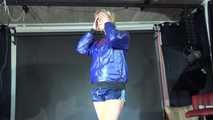 Watching sexy Pia wearing a sexy oldschool blue shiny nylon shorts and a rain jacket during her workout (Video)