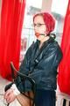 Marlin tied and gagged in a shiny blue rainsuit