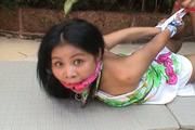 Video of innocent Ahm left struggling outside in a nice tight hogtie