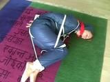 01:00 Min. video with an archive girl tied and gagged in shiny nylon rainwear