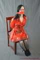 Bound in PVC minidress and red raincoat